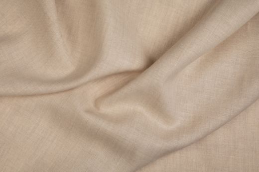 Malmedy fabric in soft beige, draped to show texture.