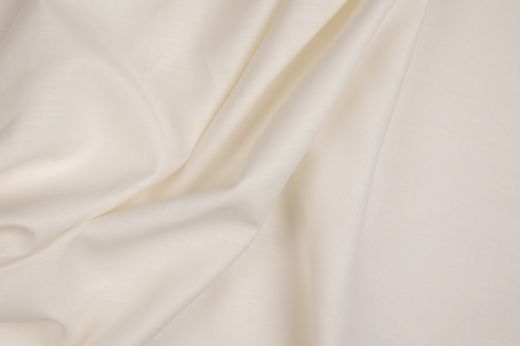 Malmedy fabric in ecru, gently folded for texture.