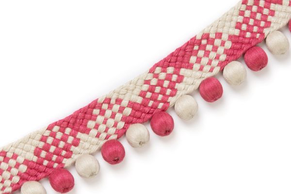 Woven trim with alternating pink and ivory diamonds and pink and white bobbles.