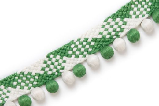 Woven trim with alternating green and white diamonds and matching bobble detailing.