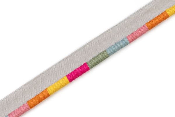 Gala piping with vibrant stripes in pink, orange, yellow, green, and blue on a neutral base.