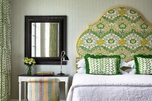 Tea Trail in Green shown on the curtain at the side of the image and also on two cushions on the bed, which have a ombre fringe. Design by Kit Kemp, Location at Firmdale Hotels, Photography by Simon Brown 