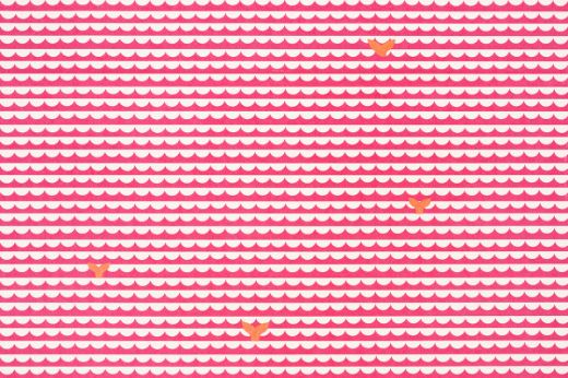 Pink and white scalloped pattern with a few orange whale tails.