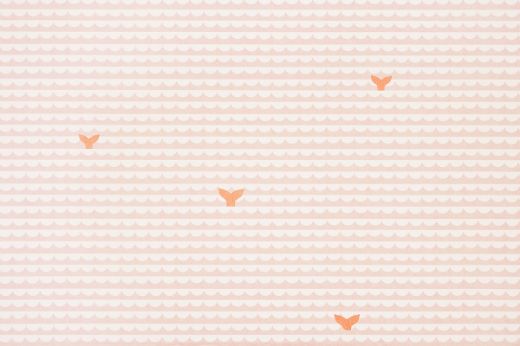 Soft peach and white scalloped pattern with bright orange whale tails.