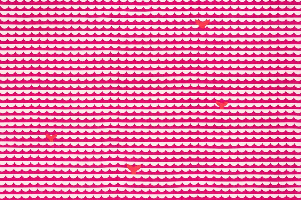 Pink and white scallop wave pattern with orange whale tails.