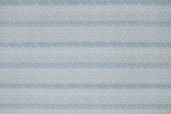 Himba Perennials, performance weave fabric in soft light blue tones with a subtle ombré effect creating depth and texture. Inspired by a traditional ethnic weave it has an open weave structure. Designed by Perennials for Christopher Farr Cloth 