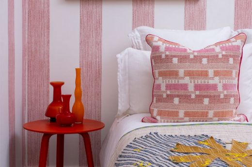 Brome Stripe custom wallpaper by Scott Yetman and 'Loom Weave' hot pink cushion by Cloth Studio. An 'Ace Weaving Truth' quilt on the bed designed by Atelier Ace and handmade by by Tessa Layzelle. Photography by Antonia Blunt