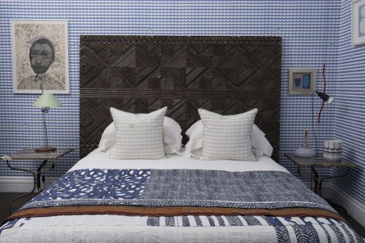 We Sailed Away cobalt wallpaper with two ‘ We Sailed Away ’ pale blue cushions by Donna Wilson / Fogo Island Collection . Photography by Antonia Blunt