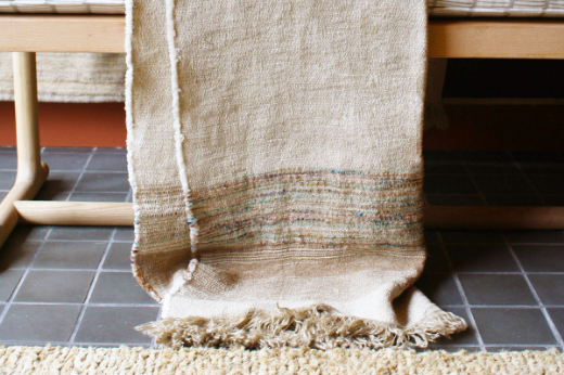 Textured woven throw natural with blue orange purple thread tones christopher farr cloth