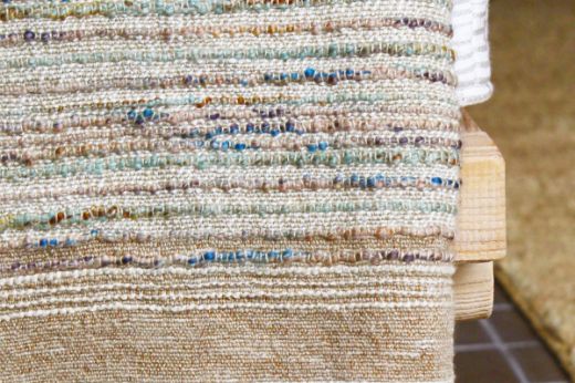 Textured woven throw natural with blue orange purple thread tones christopher farr cloth