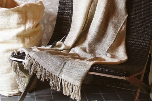 Textured woven striped natural throw black edging christopher farr cloth