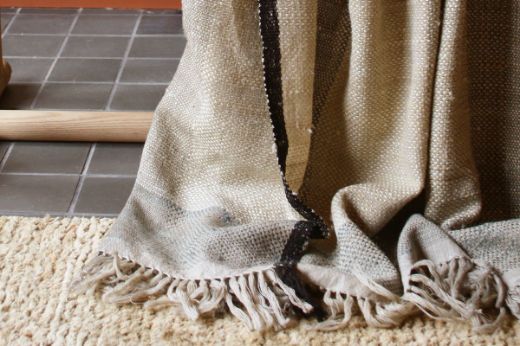 Textured woven striped natural throw black edging christopher farr cloth