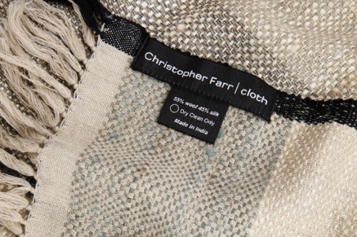 Textured woven striped natural throw black edging christopher farr cloth