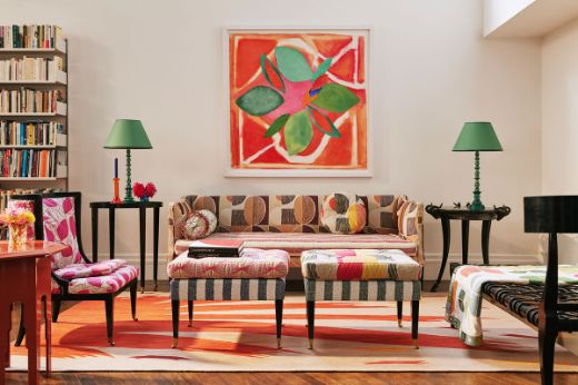 Christopher Farr Cloth Galaxie Wine upholstered sofa with Happy Flowers Dark Indigo throw and Foliage Hot Pink upholstered chair and Mikado Hot Pink footstool