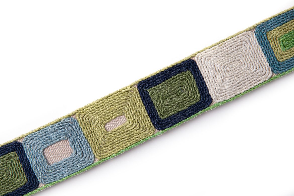 Totum Green is a embroidered geometric trim in green and blue