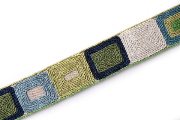 Totum Green is a embroidered geometric trim in green and blue