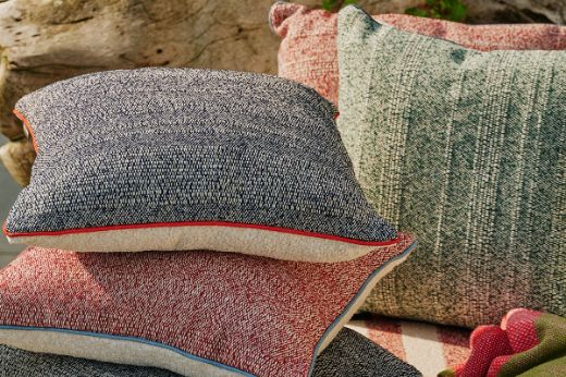 Cova woven performance outdoor cushion with Deia and Vertelli performance piping 
