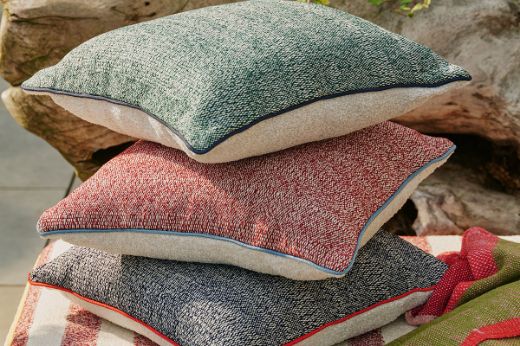 Cova woven performance outdoor cushion with Deia and Vertelli performance piping 