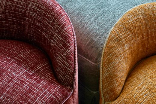 Kito Pale Blue Chair and Dodoma ruby and honey chair in the Christopher Farr Cloth Showroom