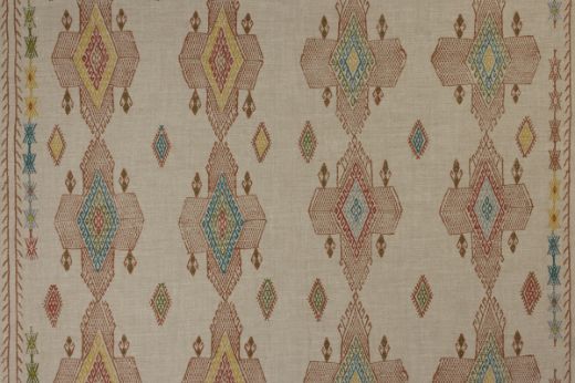 Geometric shapes in terracotta tones with pops of blues, yellow, greens and reds.