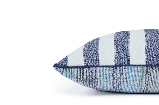Outdoor Calvari Striped Cushion Azzurro navy blue and cream hues with Vertelli Azzurro Navy blue trim side of cushion showing back which is in Arta Azzurro Fabric