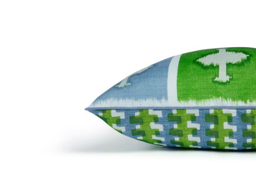 Side view of Ozone and Cremaillere Outdoor Cushion featuring a bold and repetitive geometric design in Prato green, blue, and white, contrasting geometrics, offering a modern yet timeless look for outdoor spaces.