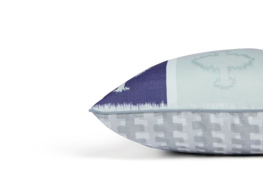 Front view of Ozone and Cremaillere Outdoor Cushion featuring a bold and repetitive geometric design in Azzurro navy blue, white and light blue with contrasting geometrics, offering a modern yet timeless look for outdoor spaces.