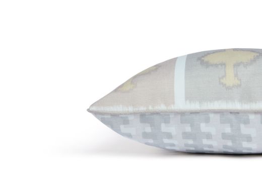 Side view of Ozone and Cremaillere Outdoor Cushion featuring a bold and repetitive geometric design in Latte, neutral, grey and white, contrasting geometrics, offering a modern yet timeless look for outdoor spaces.
