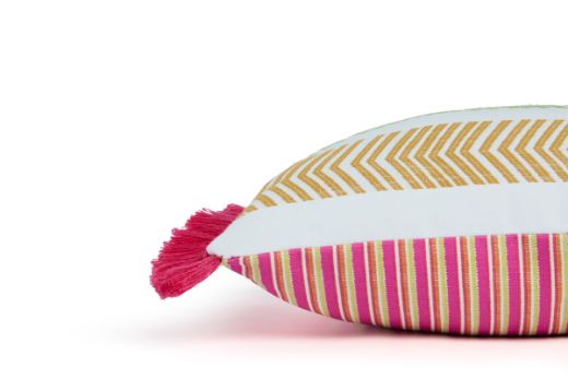 Side view of Bookend Hula Fringe Outdoor Cushion featuring a woven stripe and repetitive striped design in multi coloured front and pink and yellow colours on the back with pink Hula fringed side edges