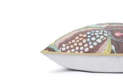 Side View of Limited Edition 01 Stockholm Carnival Cushion featuring warm brown, yellow, and mint hues with a hand-stitched pomegranate floral and leaf design, adding an artistic touch to your décor.