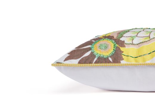 Side View of Limited Edition 06 Stockholm Carnival Cushion featuring warm brown, yellow, and mint hues with a hand-stitched pomegranate floral and leaf design, adding an artistic touch to your décor.