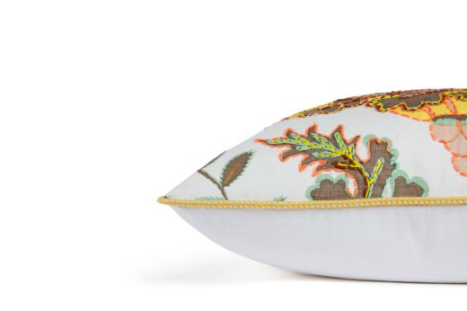 Side View of Limited Edition 05 Stockholm Carnival Cushion featuring warm brown, yellow, and mint hues with a hand-stitched pomegranate floral and leaf design, adding an artistic touch to your décor.