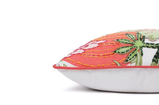 Side View Limited Edition 05 Cirque En Fleur Carnival Cushion featuring vibrant corals, greens, and pinks with a hand-stitched pomegranate floral and leaf design, adding an artistic touch to your décor.