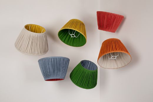 Elevated hanging Rainbow Coloured 14" UK/EU Gimbal Pleated Lampshades in Soprano Linen Fabric by Christopher Farr Cloth