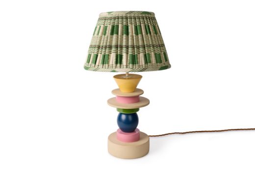 Totum ceramic lamp base featuring multi-coloured glazed blue, pink, and yellow with natural clay stacked components in triangle and circle shapes. Gold E27 bulb holder and twisted gold wire enhance the elegant design. Paired with the Lost and Found green checkered pleated lampshade, this lamp creates a fun, geometric statement piece for your interiors.