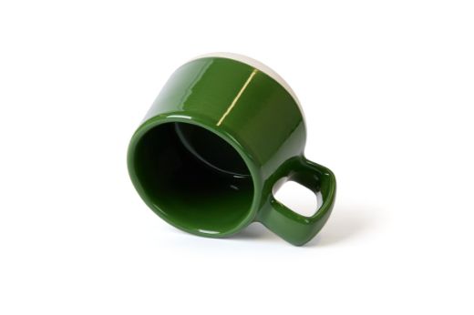 Vorster & Braye Ceramic Mug in Grass Green Laid Down to show you inside the mug which is glazed green