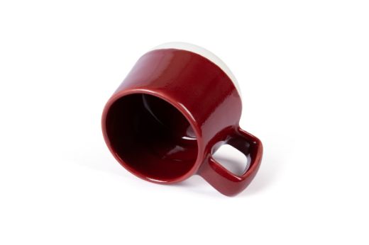 Vorster & Braye Ceramic Mug in Ruby Red Laid Down to show you inside the mug which is glazed red