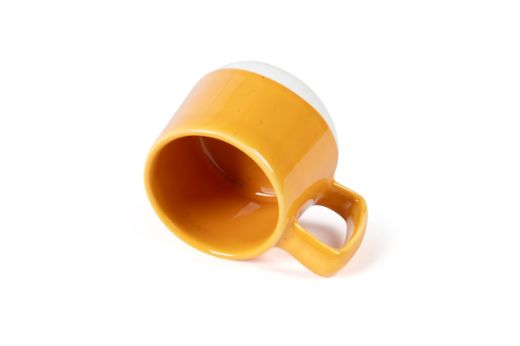 Vorster & Braye Ceramic Mug in Lemon Blue Laid Down to show you inside the mug which is glazed Yellow